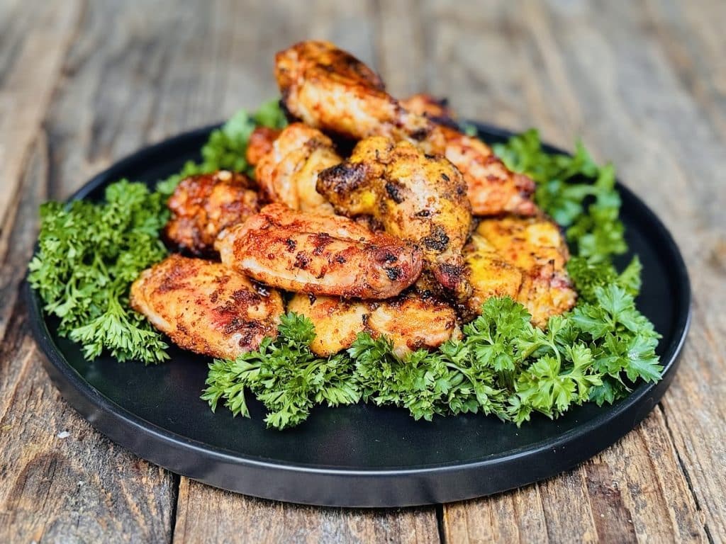 a plate of smoked chicken wings