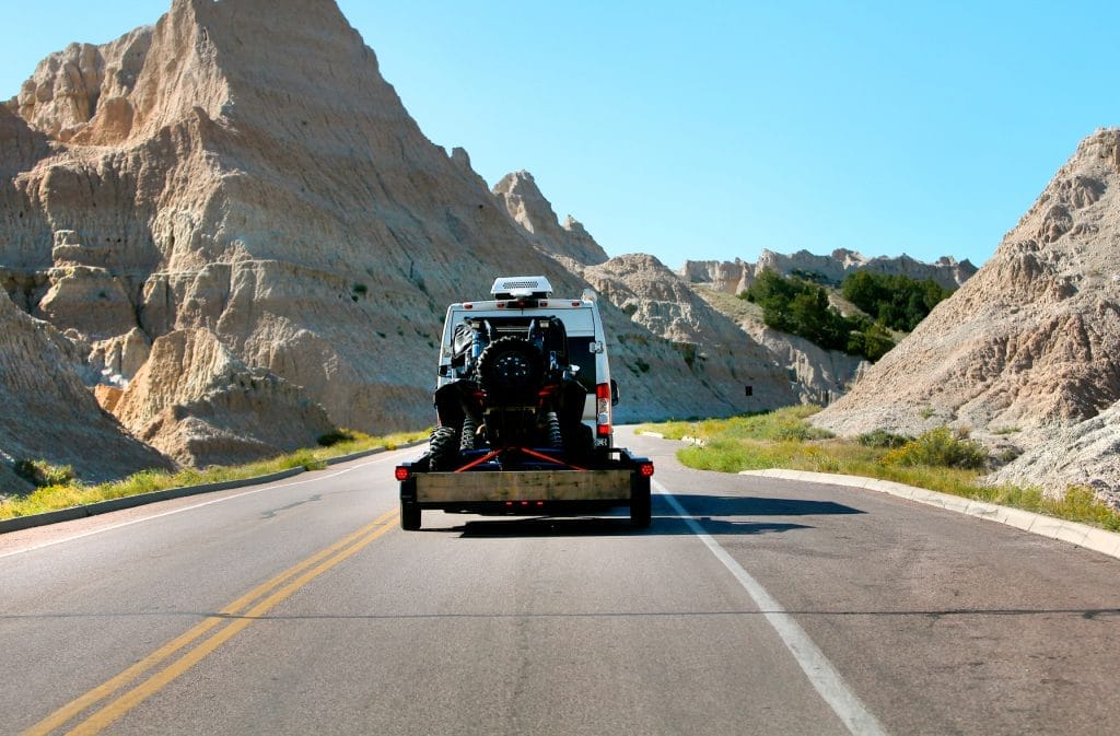 van traveling with a quad bike